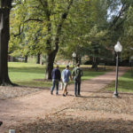 Students walk across a college campus